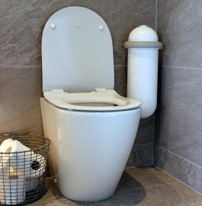 The Pod Classic Mini placed next to a toilet