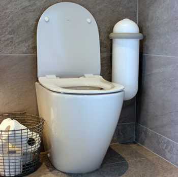 A white Pod Classic Mini Auto beside a toilet