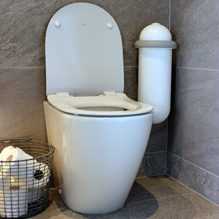 A white Pod Classic Mini Auto beside a toilet