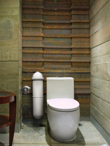 The Pod Classic sanitary pad disposal system in a tiled bathroon