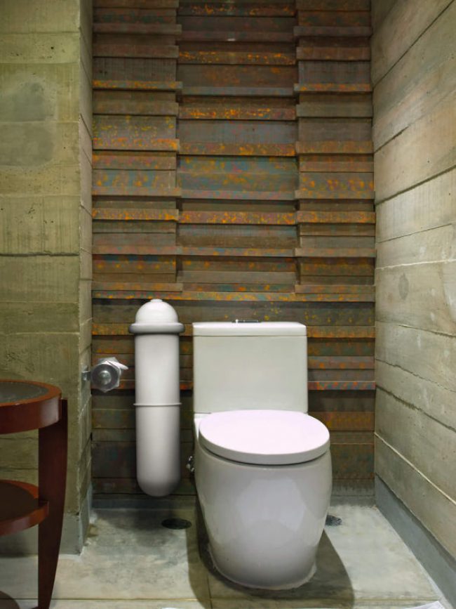 The Pod Classic sanitary pad disposal system in a tiled bathroon