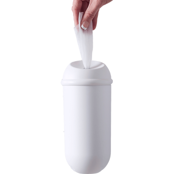 Wall mounted wipe dispenser showing hand pulling out a wet wipe